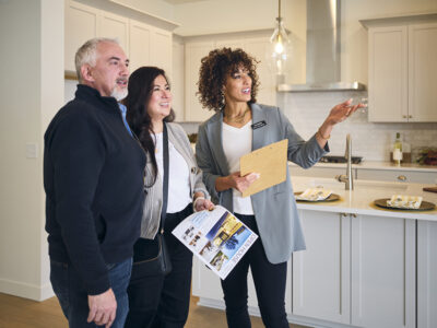 A trusted Realtor guides clients through a home tour, offering insights and personalized advice to ensure a smooth buying or selling experience.