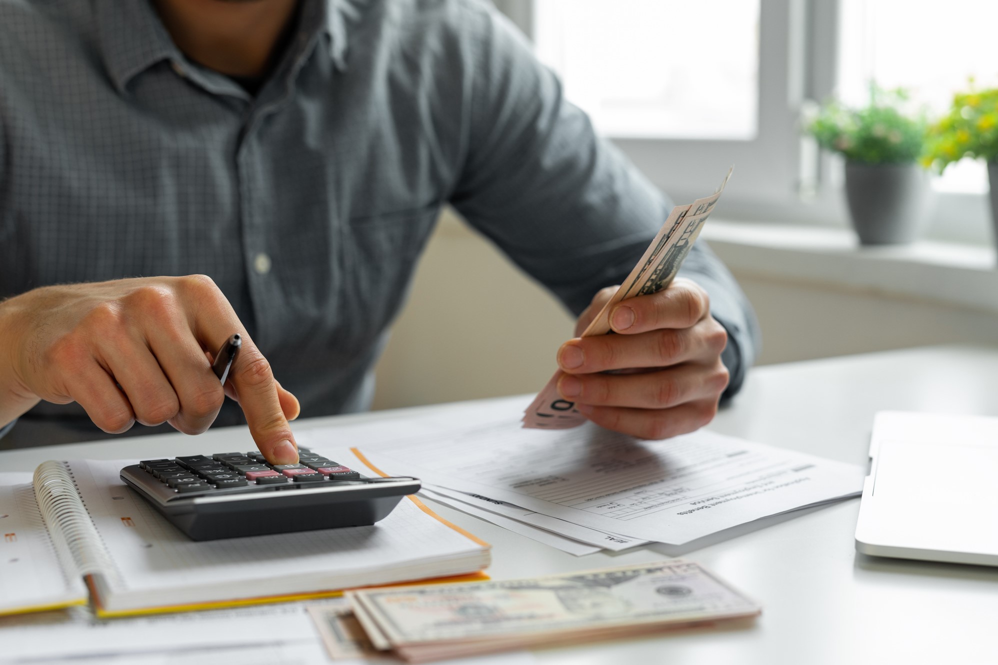 Man using calculator